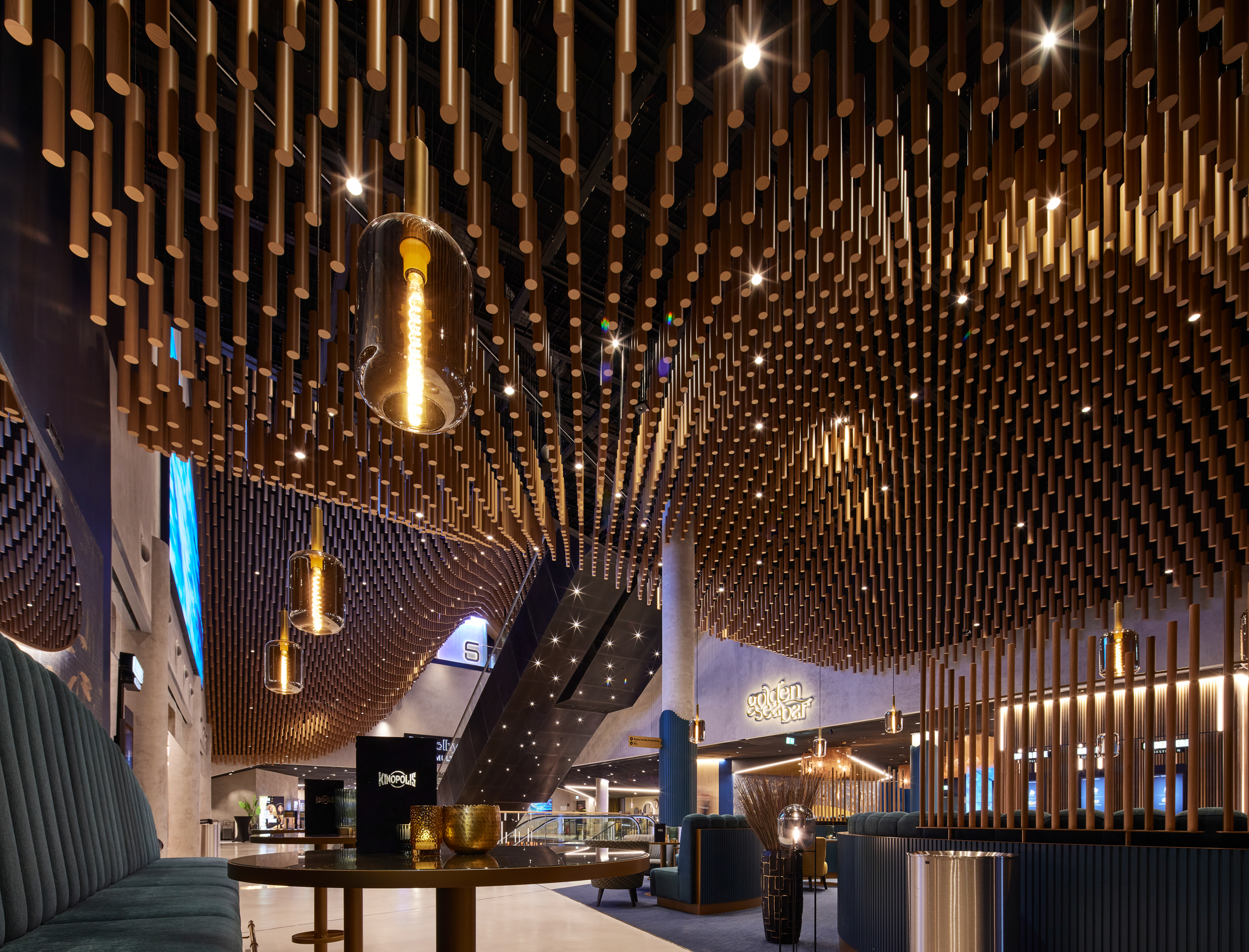 Modern cinema foyer with stylish lighting and wooden elements
